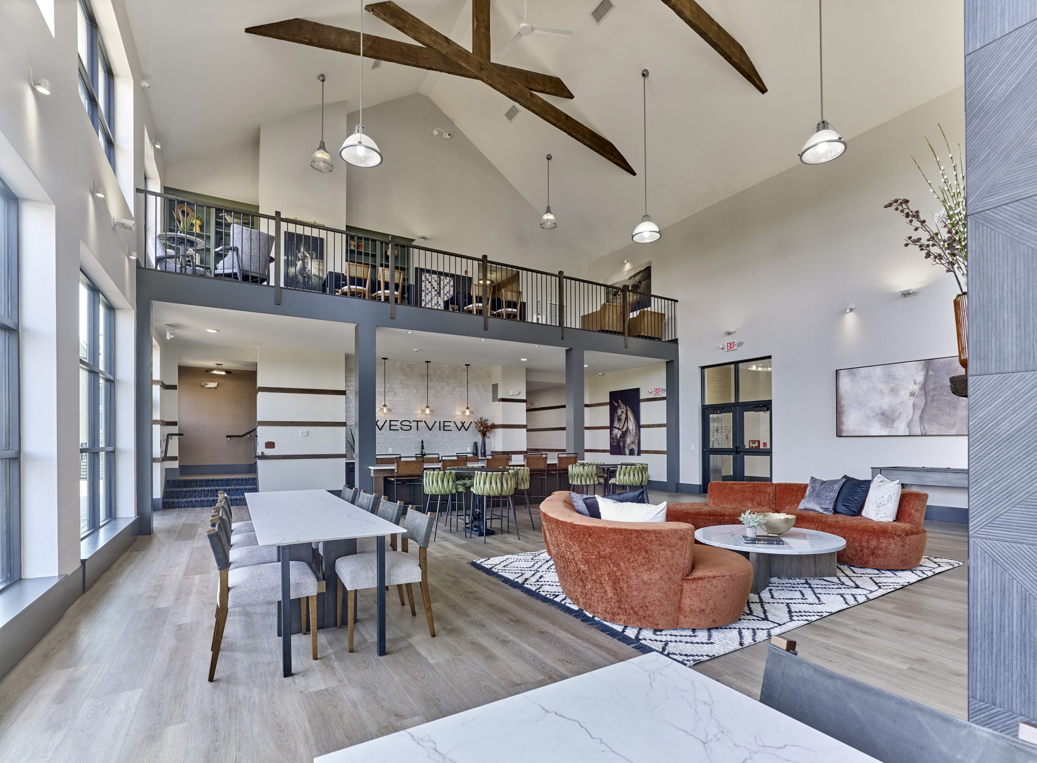 a living room with couches and chairs and a table